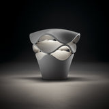 Cornet B/27 Cone LED bollard light in Stone Grey, tapered cone base with two wavy stacked layers, white interior glow, shown on a dark background.