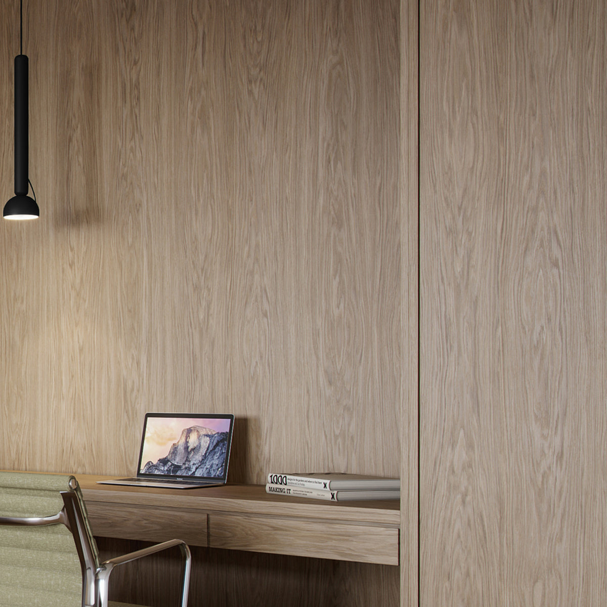 Berry S Aluminium LED Pendant Light in matte black with slim tube and angled domed head, shown above a wooden desk in a home workspace setting.
