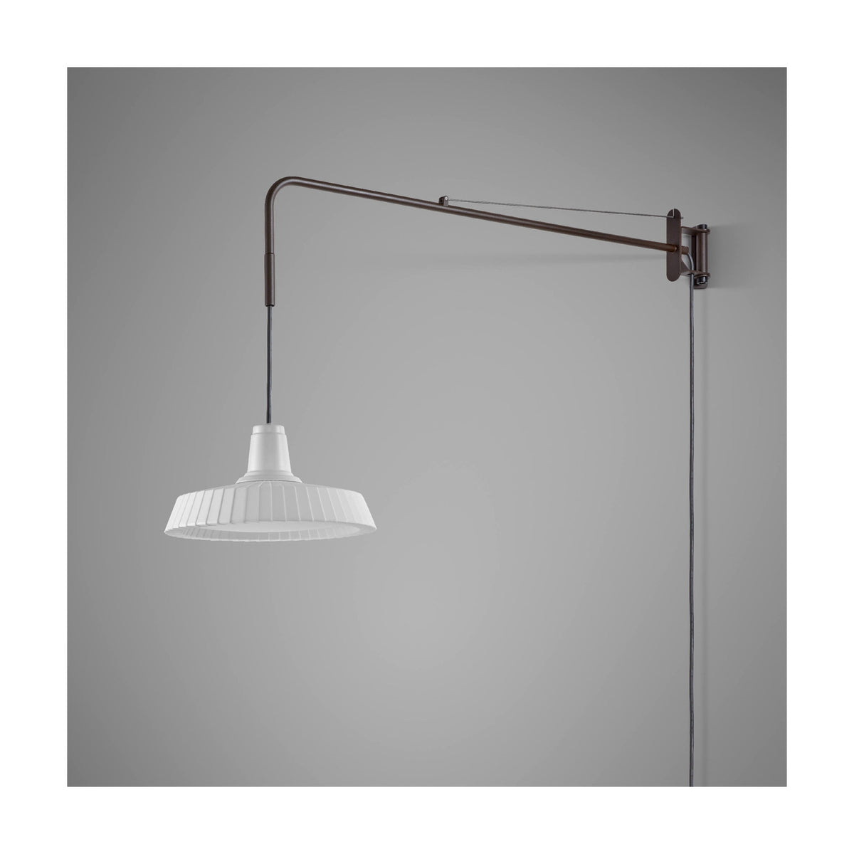 Marietta 32 A/98 outdoor wall light with long dark arm and pleated white cone shade suspended on cable, integrated LED, shown against a plain grey background.