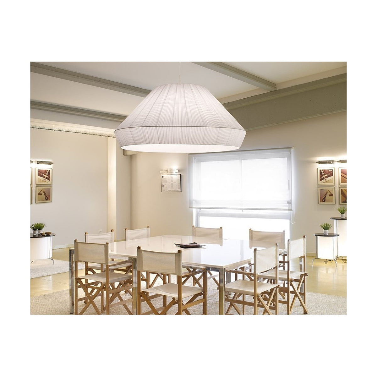 Mei 150 Ribbon Pendant Light with a large tapered white pleated shade hanging above a dining table in a neutral, modern dining room.