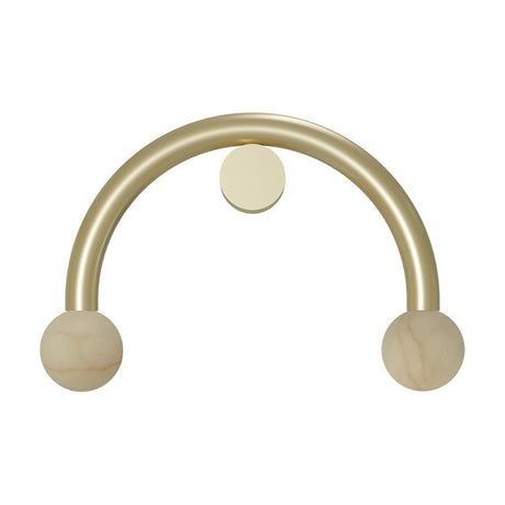 Rigoberta wall light with a curved gold iron arm forming an arch, an alabaster globe at each end, and a round gold centre fixing, shown on a plain white background.