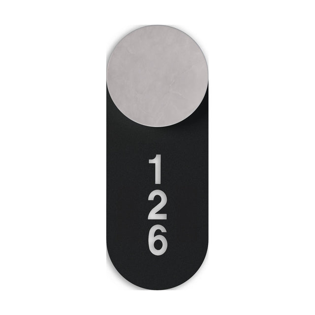 Rock Signage Tag for wall light in matt black iron, a rounded vertical plate with cut-out "126" numbering, shown behind a round light head on a white background.