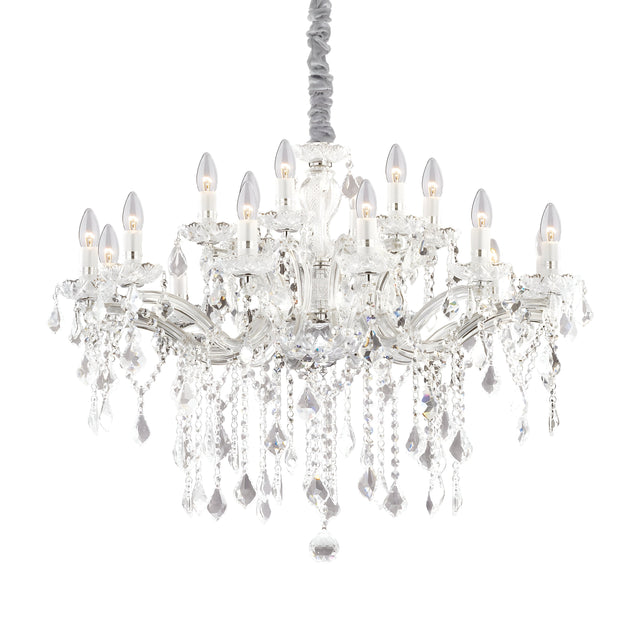 Introducing the Aurora Crystal 18 Light Chandelier - a luxurious lighting fixture featuring a chrome finish and numerous bulbs shaped like lit candles. Its intricate design is adorned with cascading crystal ornaments and suspended from a braided cord, exuding elegance and sophistication with its silver frame.