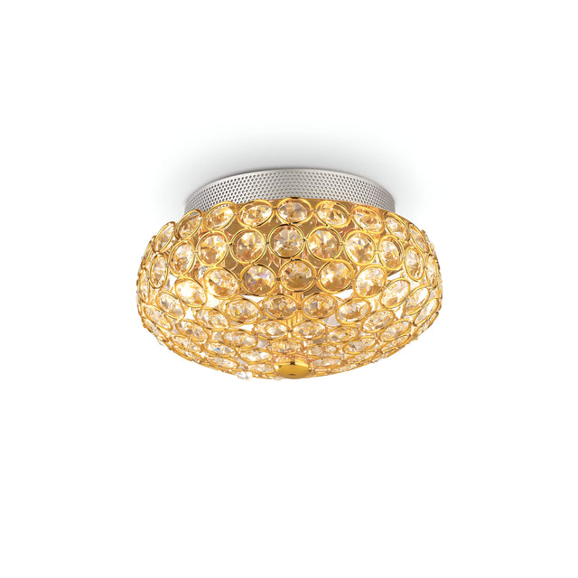 The Queen 3 Light Crystal Ceiling & Wall Light in Gold features a round, jewel-like appearance with textured circular patterns. Its metallic base adds to its luxurious lighting vibe, softly glowing to bring elegance to any room.