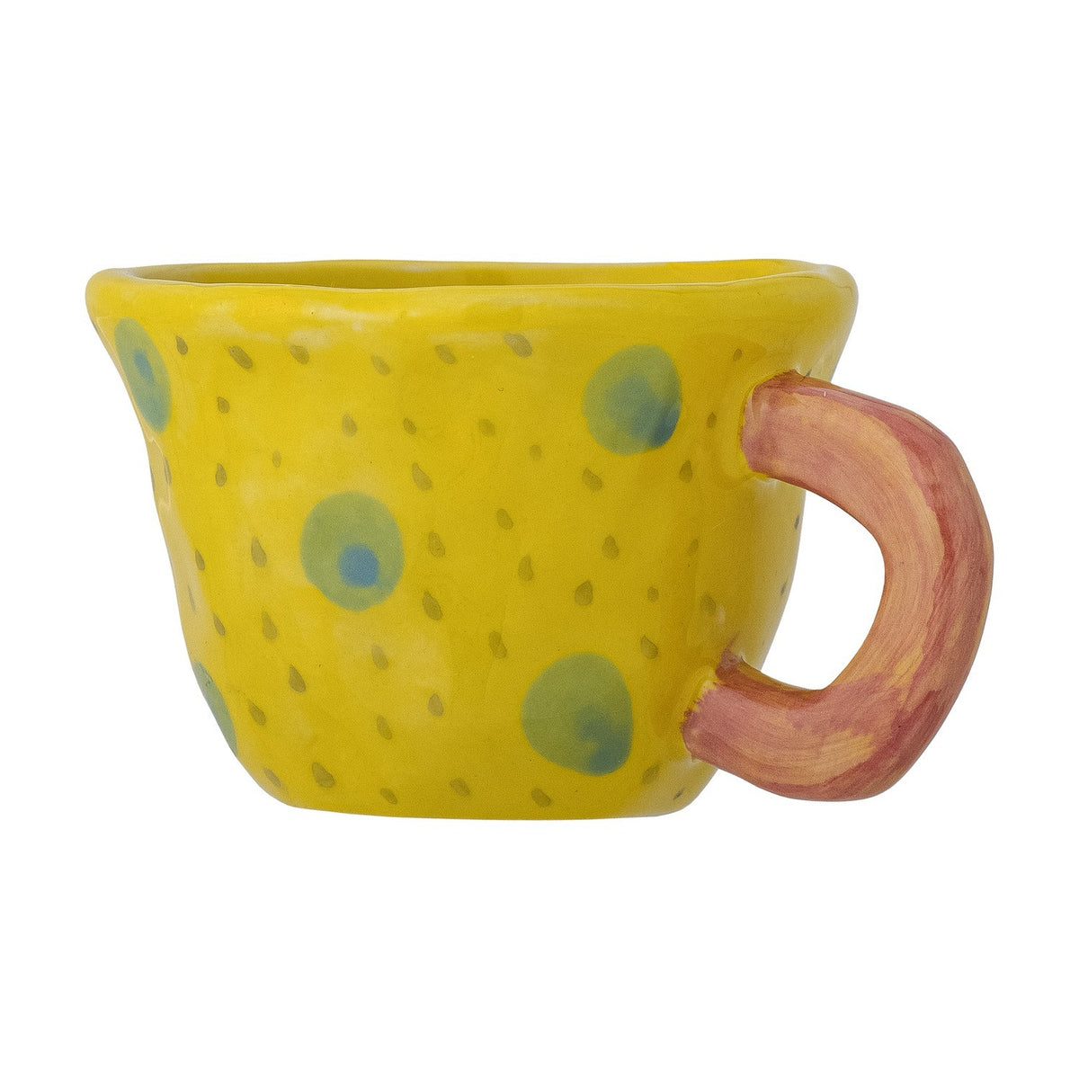 Nini Stoneware Cup in yellow with hand-painted blue and green spots, featuring a chunky pink loop handle and an irregular, handmade rim, shown on a white background.