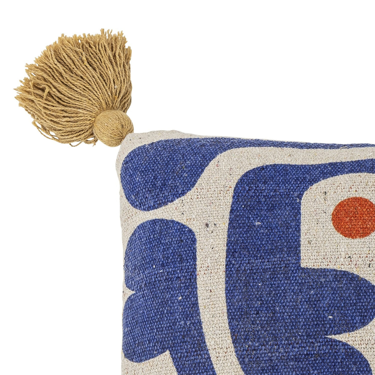 Eviaya Cotton Cushion corner detail in Multi, showing a mustard tassel and bold abstract blue and orange print on cotton fabric against a white background.