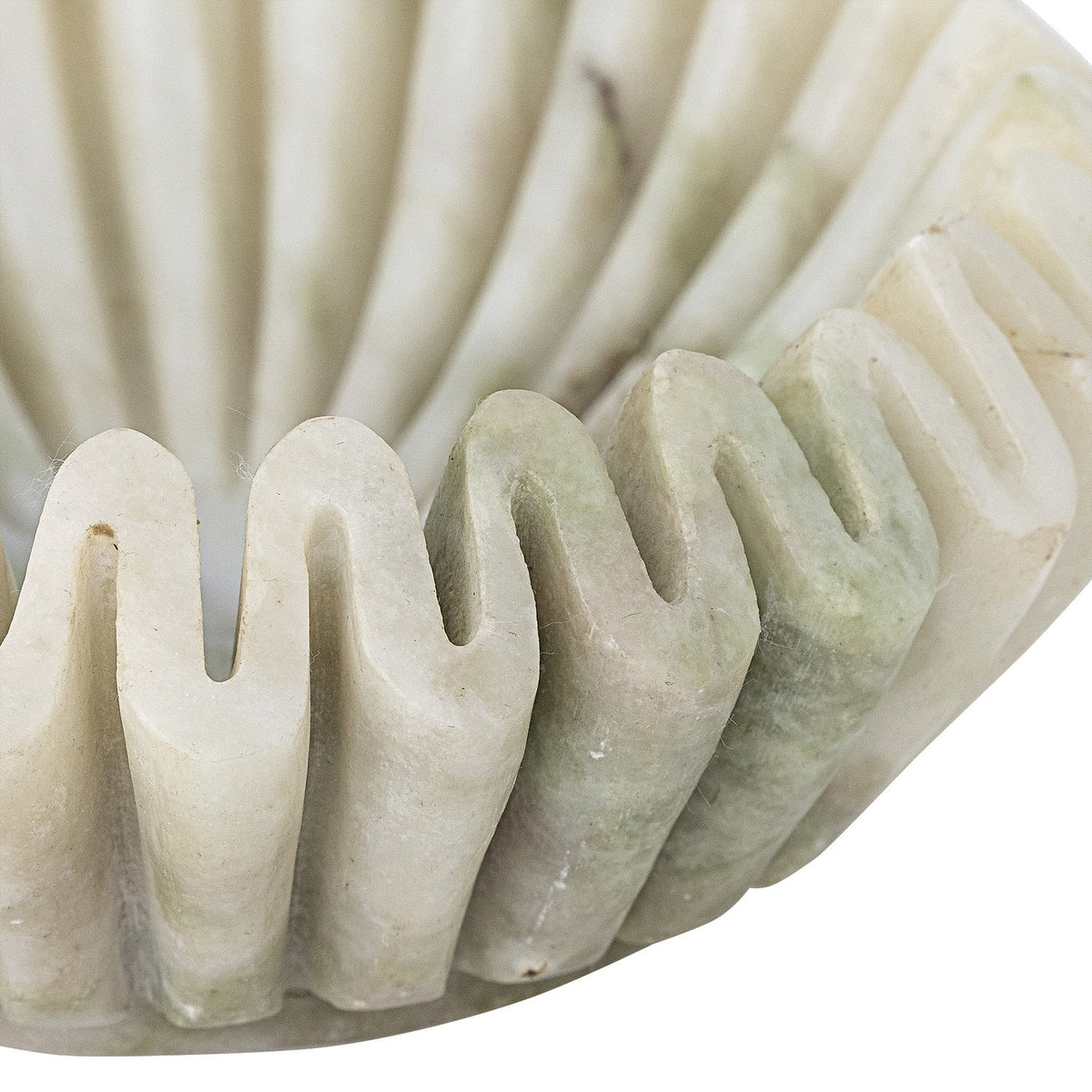 Close-up of the Harmonia Fluted Marble Bowl in white, showing deep pleated flutes and a wavy scalloped rim in polished marble with subtle grey-green veining.