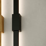 Bow Wall 300 2 Fixing Box lighting accessory in Matt Black, close-up of the rectangular fixing box on a slim vertical track with soft edge-lit glow, mounted against a plain wall.