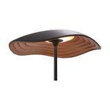 Valentina M/29 table lamp with a wavy leaf-shaped shade, black on top and copper underneath with ribbed detailing, on a slim black stem, shown on a white background.