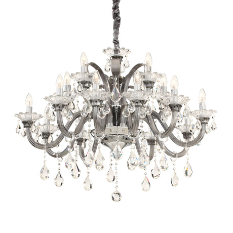 The Vivid Crystal 15 Light Chandelier - Silver features numerous arms decorated with teardrop-shaped crystal pendants. Each arm supports a small light designed to resemble a candle, creating an opulent and illuminated look. This sophisticated piece hangs from a dark braided chain, exuding brilliance and charm throughout the space.