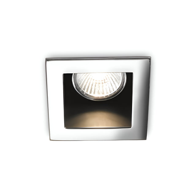 Introducing the Shimmer Recessed Downlight- Chrome, a square, chrome-plated fixture with a contemporary design. It features a single centrally positioned bulb and emits an even glow when illuminated.