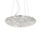 The Queen 12 Light Crystal Suspension - Chrome is a modern round chandelier featuring a sparkling crystal suspension design and sleek chrome finish, suspended from multiple wires. This light fixture showcases numerous small, clear orbs that produce a shimmering effect against a plain white background.