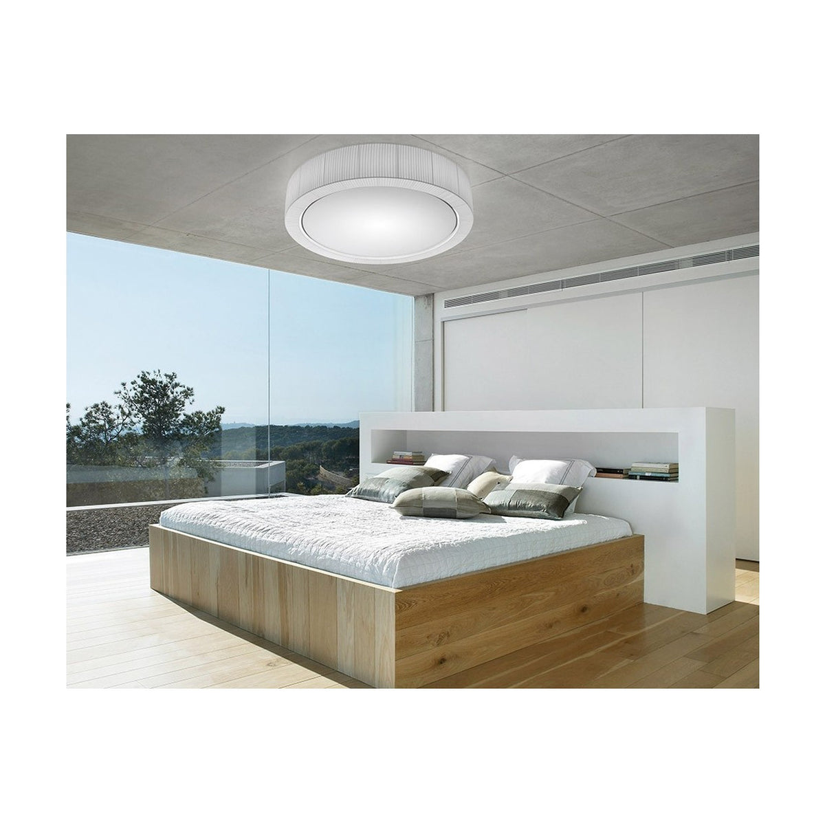 Urban PF/120 Ribbon LED ceiling light in white, a round drum fixture mounted on a concrete bedroom ceiling above a wooden bed with floor-to-ceiling windows.