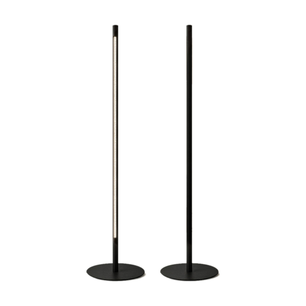 Solid F 180 cylinder LED floor lamp with slim black upright column, illuminated stem section, and round flat base, shown beside a matching unlit lamp on a white background.