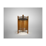 Kando M/40/R rechargeable outdoor table lamp with sand-coloured nautical cord cylinder, teak wood uprights, and dark top, shown lit against a plain light grey background.