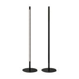 Solid F 240 Cylinder LED Floor Lamp shown lit and unlit side by side, slim black aluminium stem on a round disc base with a vertical integrated LED strip, on a plain white background.