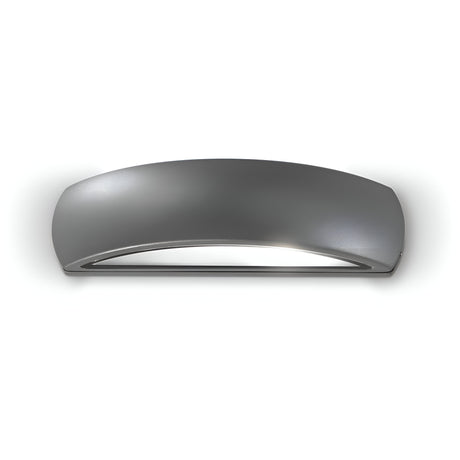 The Solara Outdoor Wall Light in anthracite features a sleek, curved design ideal for modern exteriors. This weather-resistant metallic fixture emits a glowing light from its lower section, softly illuminating the wall to create a stylish ambiance.
