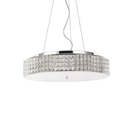 Introducing the Nebula 9 Light Crystal Suspension in Chrome: a contemporary circular pendant light featuring crystal-like accents along its edge. It hangs elegantly from the ceiling on adjustable suspension cables, projecting a soft glow through its frosted glass underside.