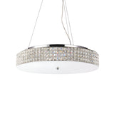 The Nebula 12 Light Crystal Suspension - Chrome is a stylish lighting fixture featuring a circular chrome design and crystal-studded rim, elegantly suspended by adjustable cables. It showcases a frosted glass bottom, offering an elegant and contemporary aesthetic.