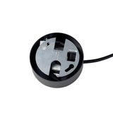 Close-up of the Blaze 1 Light Pendant in black, showcasing its circular design with visible metallic internal components featuring various shapes and openings. A cable extends from the side. The modern lighting design exudes a technical and industrial vibe.