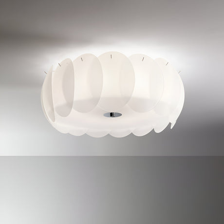 The Nero 8 Ceiling Light - White is a contemporary fixture featuring a circular arrangement of overlapping, acid-etched glass panels that emit a gentle, diffused glow onto the ceiling and walls. With its simple, minimalist design, this flush mount lamp is ideal for any modern space.