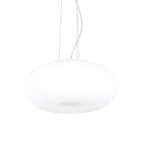 This contemporary lighting piece, the Vail 3 Light Pendant in white with a 42cm oval shape, suspends from the ceiling using slender cables. Its sleek, glossy surface emits a soft glow, complementing a minimalist design and modern aesthetic.