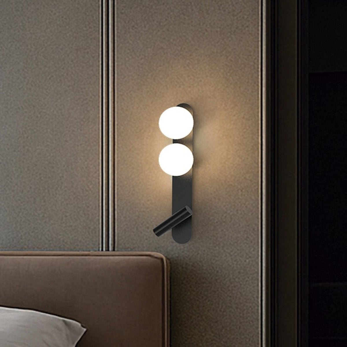 Bubble Opal Globe Wall Light with Reading Light in matt black, two opal glass globes on a slim backplate with an angled LED reading light, mounted above a bed.
