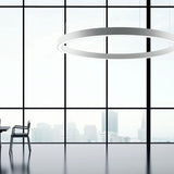 Golden Ring Aluminium LED Pendant Light in white, 123cm diameter, hung above a dining area with floor-to-ceiling windows overlooking a city skyline.