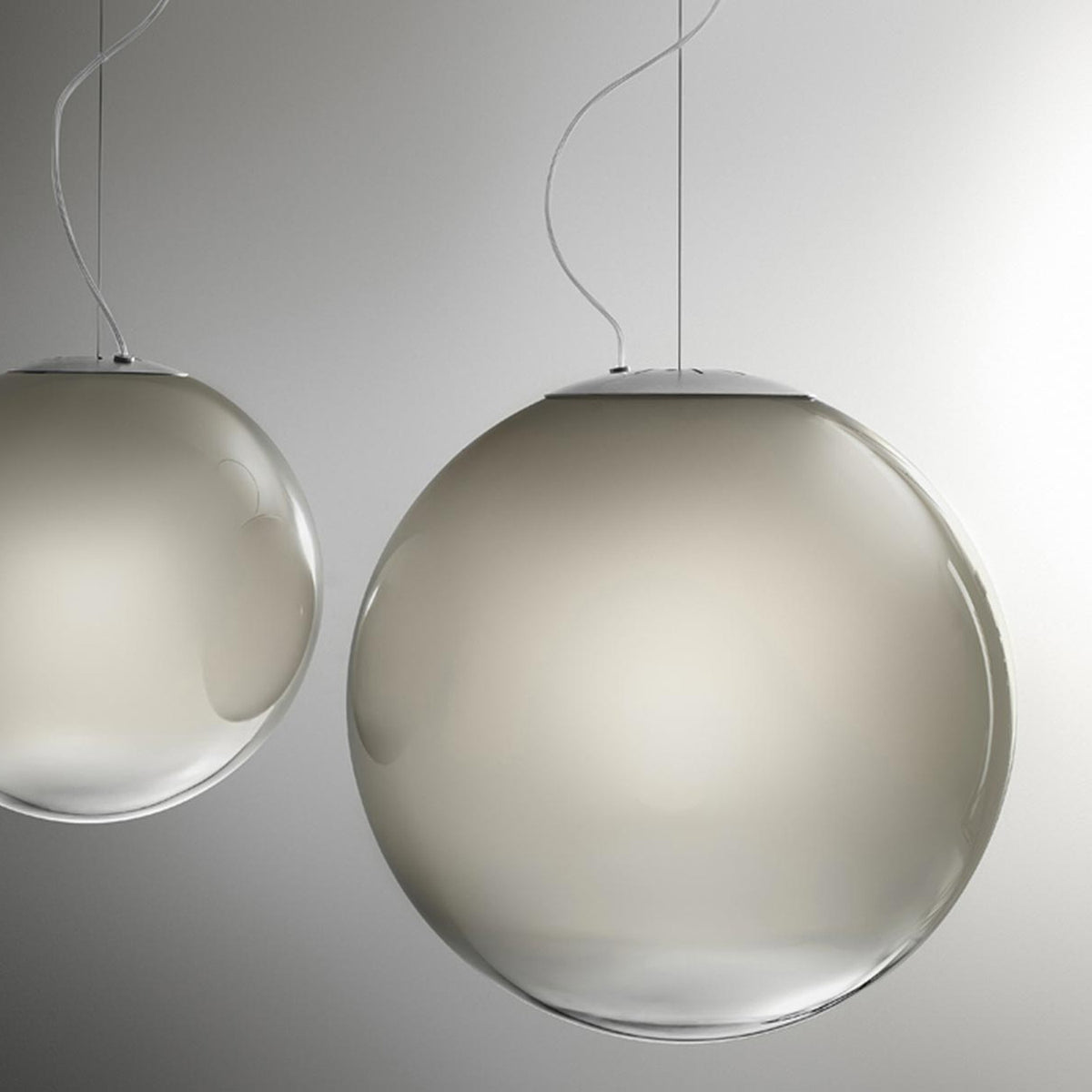 Smoke Glass Globe LED Pendant Light 35cm, two spherical glass pendants in graded smoky grey with round silver ceiling canopies, shown against a plain light grey background.