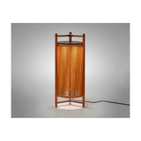 Kando P/111 outdoor floor lamp, lantern-style cylinder of sand nautical cord within a teak wood frame, topped with a dark brown disc, glowing warmly on a plain light grey background.