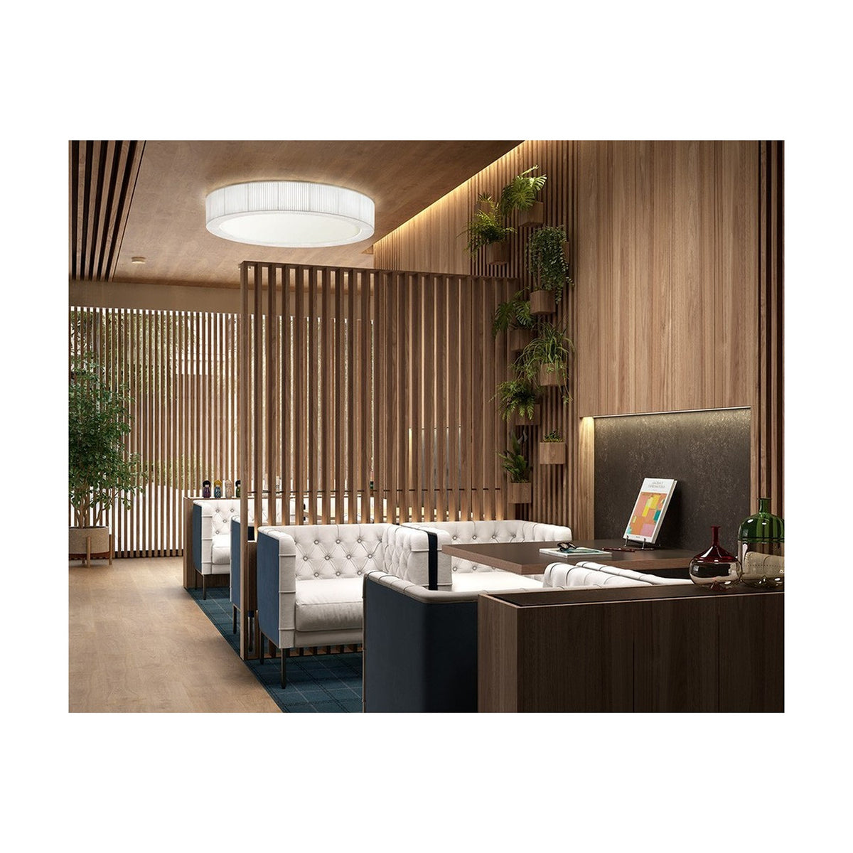 Urban PF/120 Ribbon LED ceiling light with a round white drum shade and integrated warm white LED, illuminating a wood-slatted lounge with white tufted sofas.