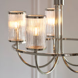 Close-up of Endon Brenfield 5 Light Pendant in nickel, showing curved arms and clear ribbed cylindrical glass shades with bubble detail.