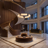 Anellara LED Radial Alabaster Chandelier 80cm in black and white, a ring-mounted fixture with angled alabaster blocks, shown above a hotel lobby's marble table and spiral staircase.