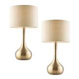 Endon Chartbury LED table lamp twin pack with brass teardrop bases and beige fabric drum shades, shown on a plain white background.