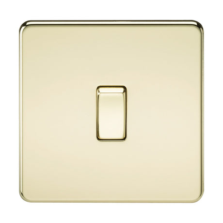 A single polished brass square light switch with a glossy, screwless low profile design, centered on a plain background.