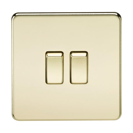 This sleek 10AX 2 Gang 2-Way Switch - Polished Brass (Screwless) features a screwless, low-profile design with a shiny gold-colored finish. It includes two centrally located toggles on a square plate with rounded edges and boasts a smooth and reflective polished brass surface.