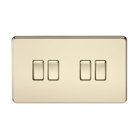 Introducing the 10AX 4 Gang 2-Way Switch in Polished Brass, featuring a modern screwless design and a sleek reflective finish. The rectangular switches are evenly distributed across its shiny brass surface, offering a sophisticated and seamless look.