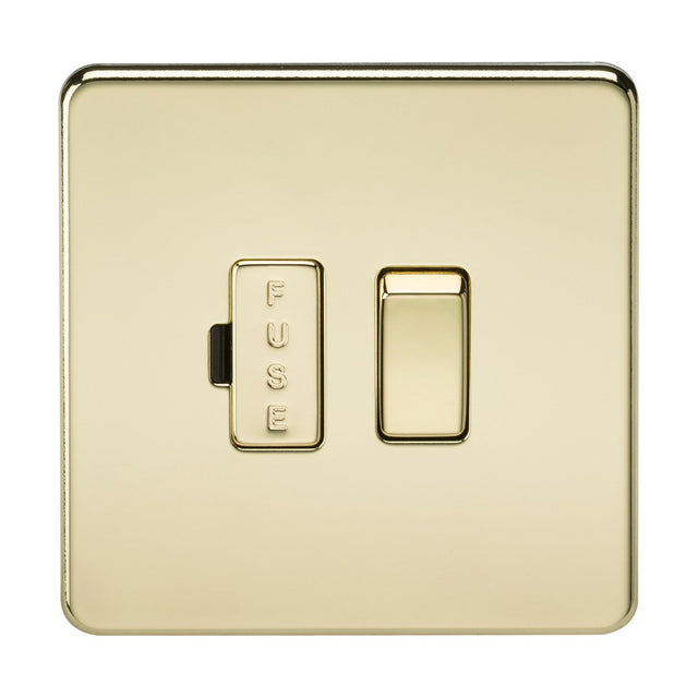 The 13A Switched Fused Spur Unit in polished brass boasts a screwless design, featuring a labeled FUSE section on the left and a standard switch on the right.