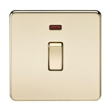 The 20A 1 Gang DP Switch Neon - Polished Brass (Screwless) showcases a sleek screwless design in polished brass, with a red indicator against a white backdrop. The switch is set to the off position, centered within its rectangular shape on the reflective metallic plate for a modern and minimalist look.