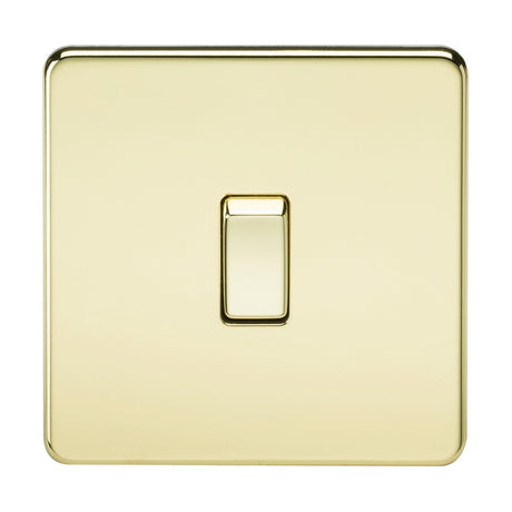 A gleaming Polished Brass 20A 1 Gang DP Switch, set against a simple background, showcases a central toggle. Its screwless design is sleek and low-profile, offering a smooth and reflective finish for a sophisticated look.