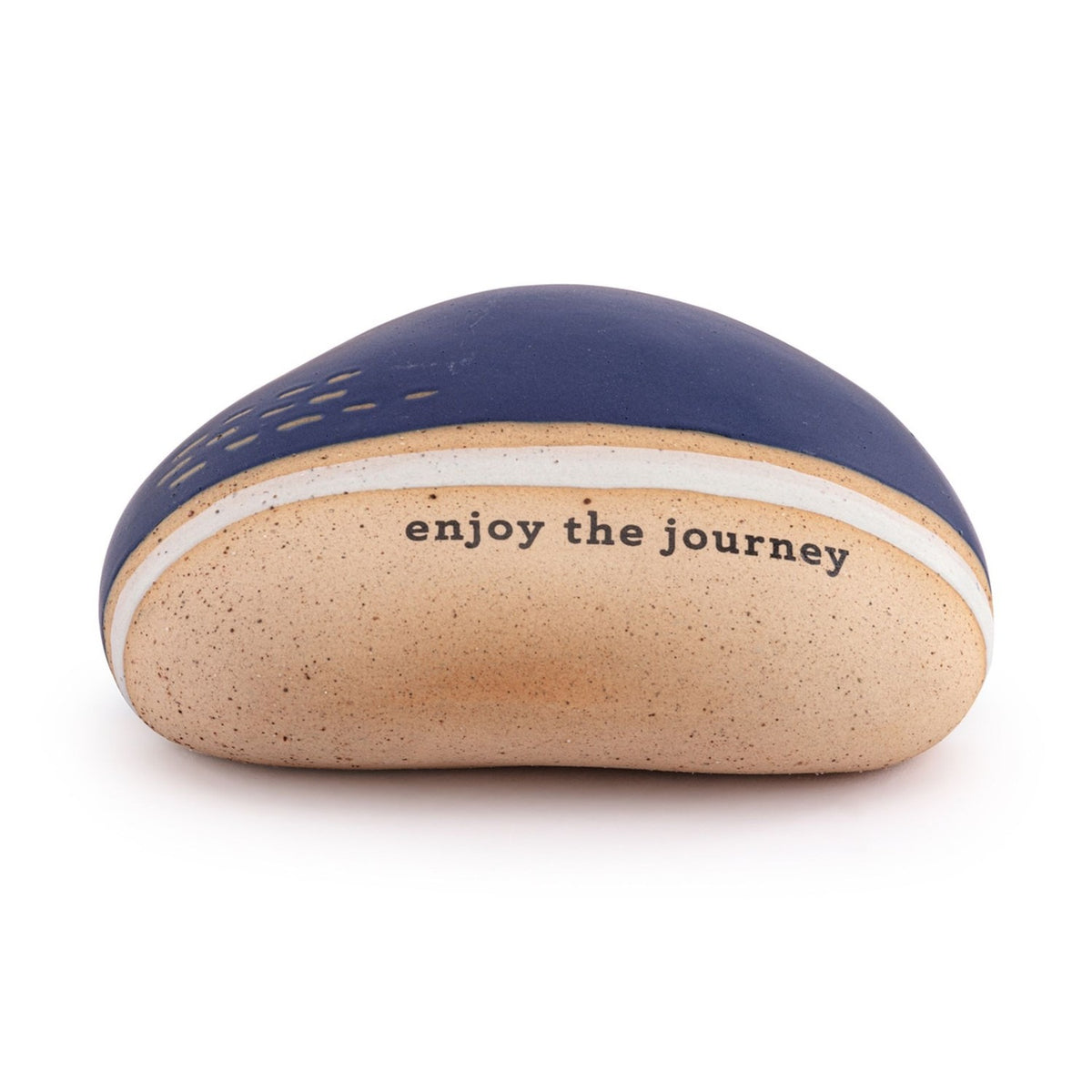 Speckled ceramic stone ornament with navy blue top, sand-coloured speckled base, white stripe, and "enjoy the journey" text, on a plain white background.