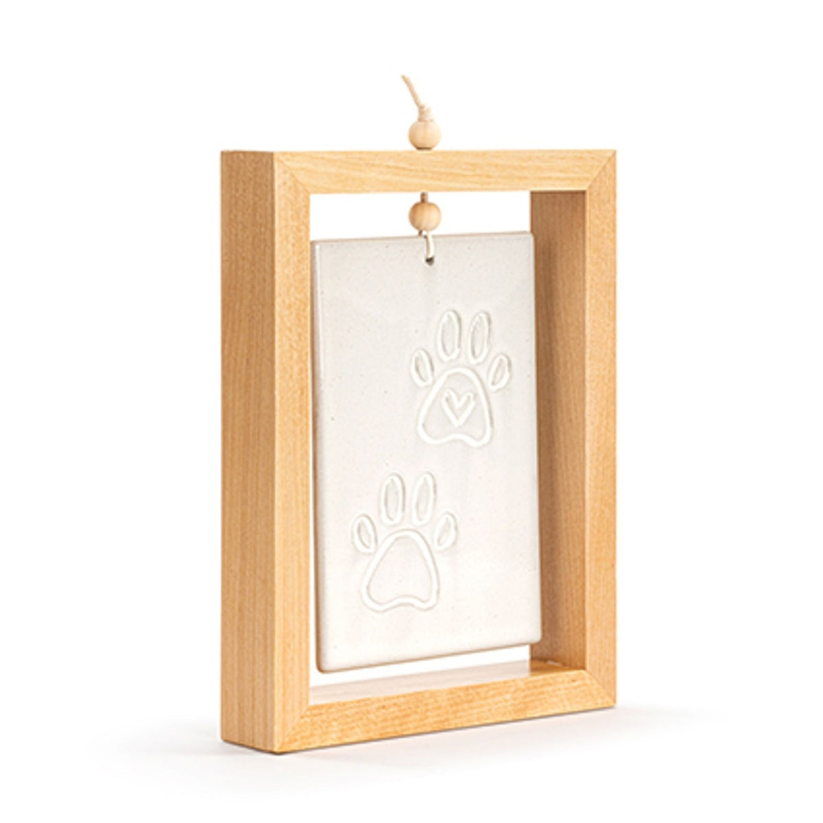 Four Paws Standing Ceramic Plaque in a rectangular light wood frame, stone-coloured tile with two raised paw prints and a heart detail, shown on a plain white background.