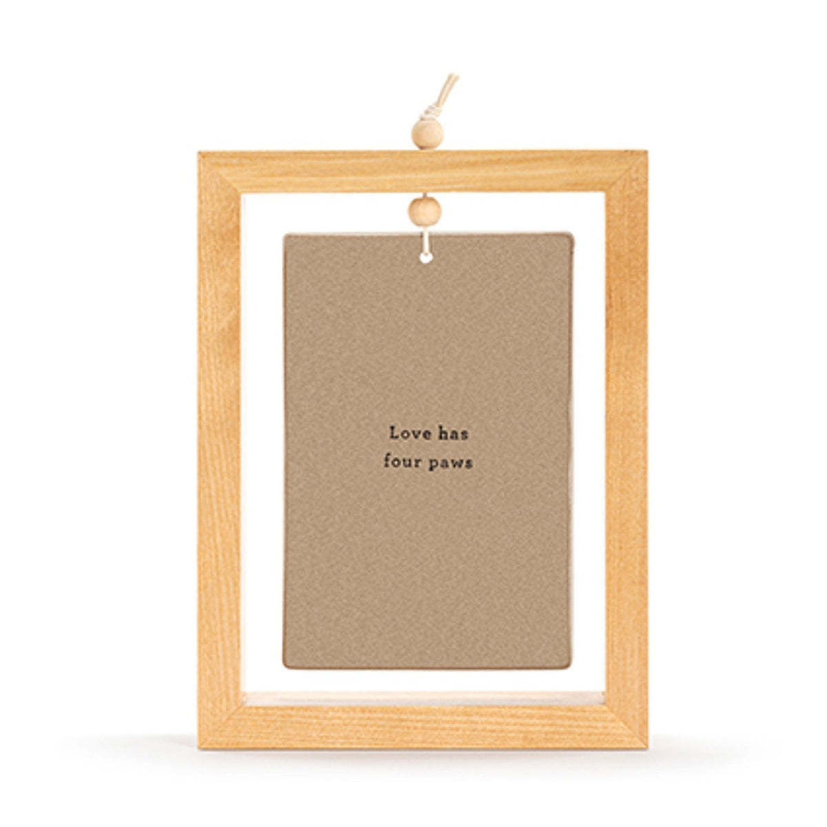 Ceramic standing plaque in a light wood rectangular frame with hanging cord, brown face reading "Love has four paws", shown on a plain white background.