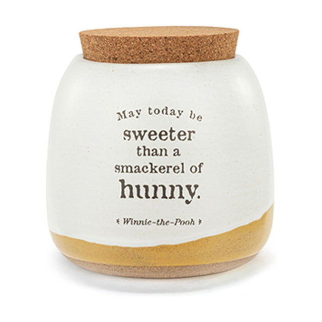 Ceramic storage jar with cork lid, stone glaze finish and mustard-yellow base band, printed with "May today be sweeter than a smackerel of hunny" quote, on a white background.