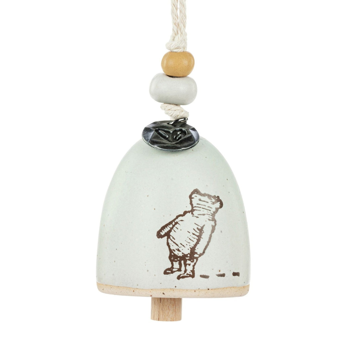 Ceramic mini bell ornament in stone colour with an arched shape, featuring a brown line drawing of Winnie the Pooh seen from behind, a wooden clapper, and beaded hanging cord on a white background.