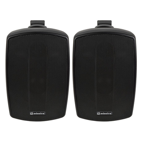 A pair of black Adastra BH4 4" 60W speakers with protective grilles, set against a white background. These IP44-rated weather-resistant speakers are perfect for indoor or outdoor use and come with top brackets for easy wall installation.