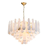 The Veloria Large Floating Petal Alabaster Chandelier features layered, soft white teardrop-shaped glass on a brushed brass chain and mount, creating a warm, elegant glow.