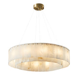 The Arvello 14 Light Layered Panel Alabaster Chandelier in Soft White & Brass adds understated elegance to any room with its circular layered design.