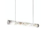 The Zareon LED Small Linear Alabaster Suspension Light – Soft White features a modern cylindrical alabaster shade, suspended horizontally by two thin cables, and emits soft white linear lighting.