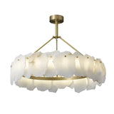 The Marvion LED Large Petal Alabaster Chandelier features a brass frame with frosted, irregular glass panels in a circular design, blending modern elegance with Spanish alabaster lighting style in soft white.